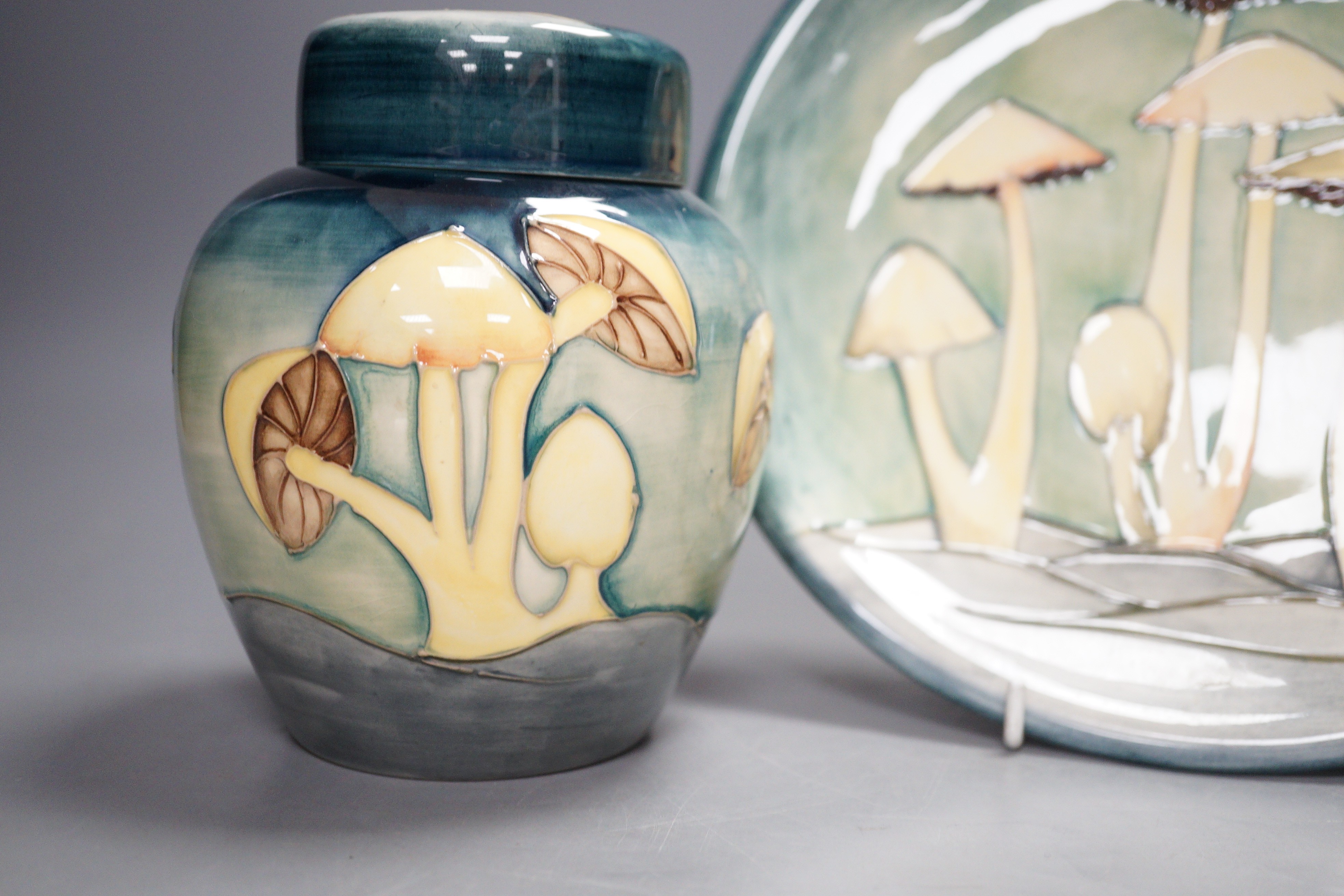 A Moorcroft pottery dish and ginger jar and cover, each decorated with the 